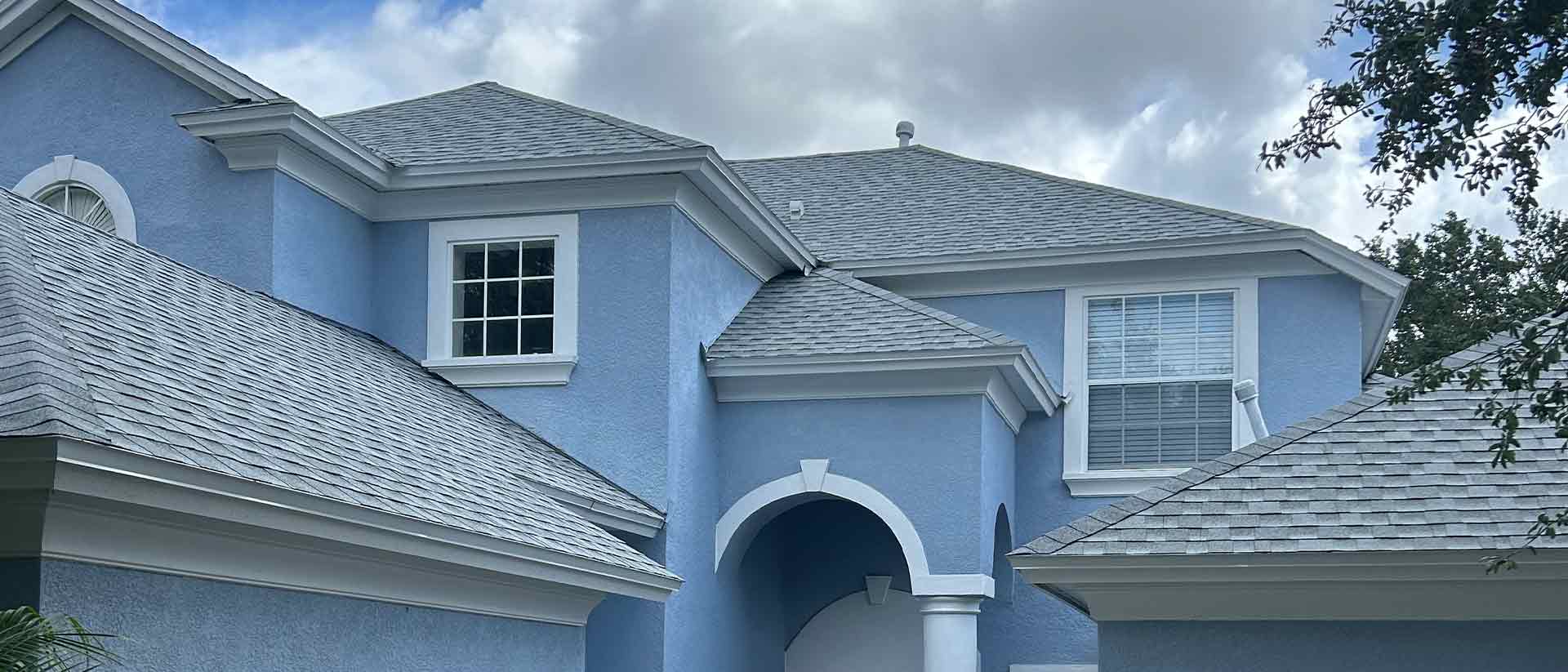 Blue House Gray Roof Shingles
